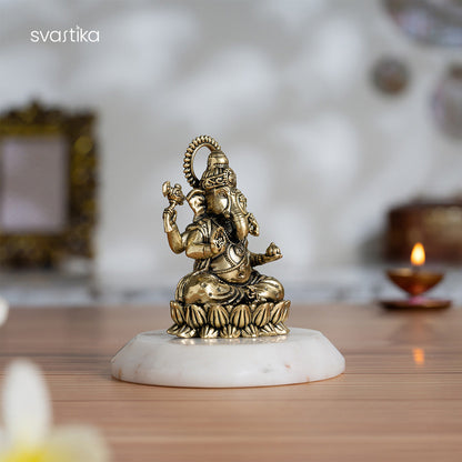 Brass Left-Trunk Ganesha Murti Sitting On Lotus (3 Inch)