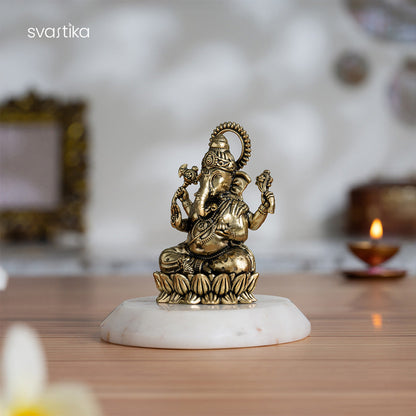 Brass Left-Trunk Ganesha Murti Sitting On Lotus (3 Inch)