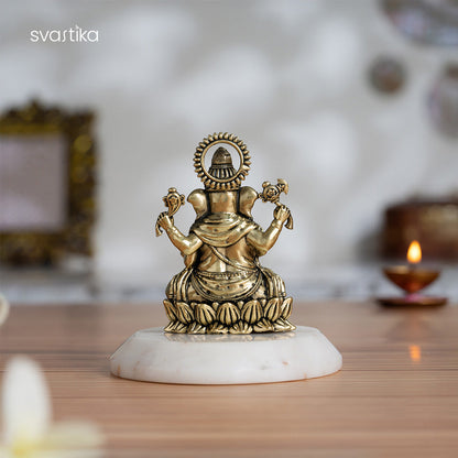 Brass Left-Trunk Ganesha Murti Sitting On Lotus (3 Inch)